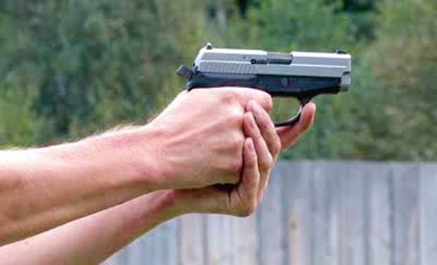 STOCK-FOOTAGE-MAN-SHOOTING-WITH-PISTOL