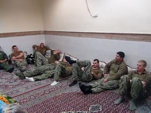 An undated picture released by Iran's Revolutionary Guards website shows American sailors sitting in a unknown place in Iran. REUTERS/sepahnews.ir/TIMA/Handout via Reuters