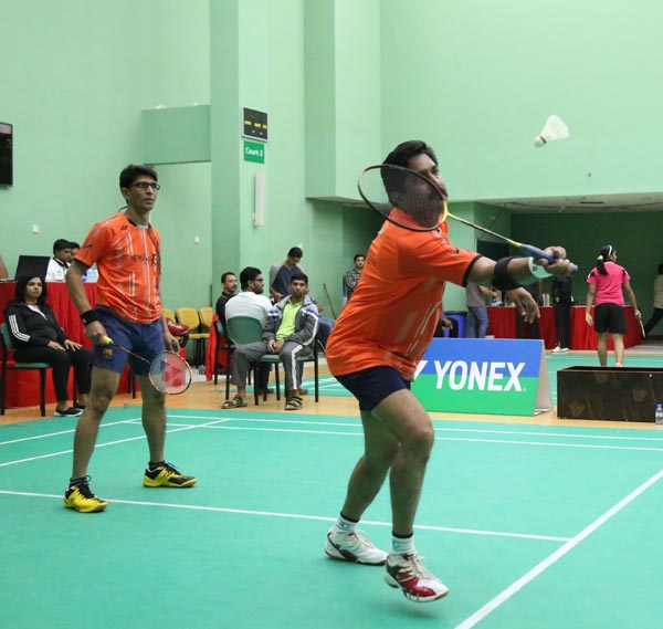 Nazir Dean in action in Super Veteran Doubles final while Abdul Salam watching the shot