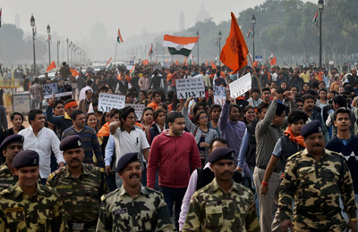 New Delhi: ABVP activists protest against an event at JNU supporting Parliament attack convict Afzal Guru in New Delhi on Friday. PTI Photo by Kamal Singh(PTI2_12_2016_000106b)