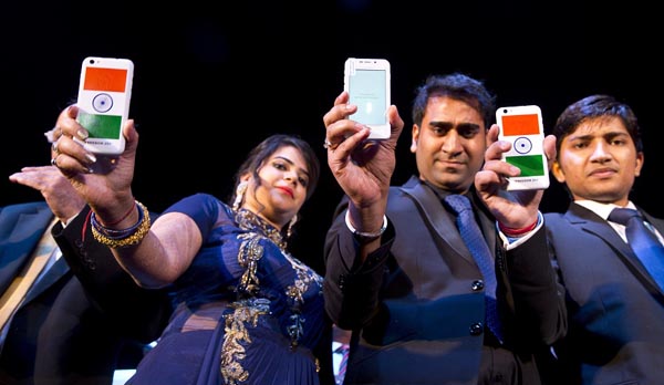 A Freedom 251 smartphone, which is to be priced at Indian Rupees 251 or USD 3.6 approximately, is shown during its release by officials of Ringing Bells Pvt. Ltd. in New Delhi, India, Wednesday, Feb. 17, 2016.(AP Photo/Saurabh Das)