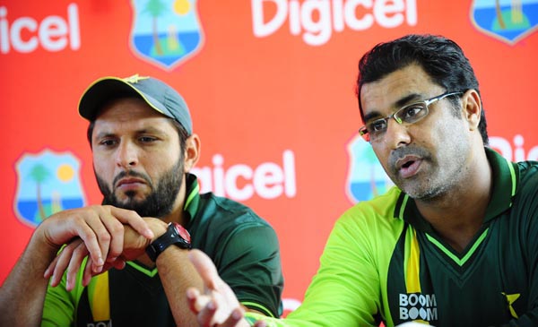 Pakistani captain Shahid Afridi (L) and coach Waqar Younis address a press conference during a training session at the Beausejour Cricket Ground in Gros Islet, St Lucia, April 20, 2011. The West Indies and Pakistan will play one Twenty 20 match, five ODIs and two test starting April 21, 2011. AFP PHOTO/Emmanuel Dunand (Photo credit should read EMMANUEL DUNAND/AFP/Getty Images)