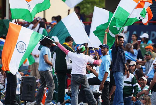 CENTURION, SOUTH AFRICA - SEPTEMBER 26:  Fans cheer on their team during the  ICC Champions Trophy group A match between India and Pakistan at Centurion on September 26, 2009 in Centurion, South Africa.  (Photo by Tom Shaw/Getty Images)