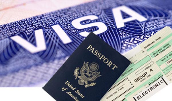 Photograph of a passport with airplane boarding pass. isolated on white.