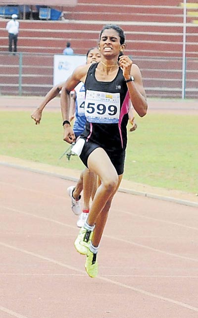 M R Poovamma from ONGC won the Gold medal in Women’s 400m at a19th Federation Cup, National Senior Athletics Championship at Mangala Stadium in Mangaluru on Monday. –Photo/ Govindraj Javali