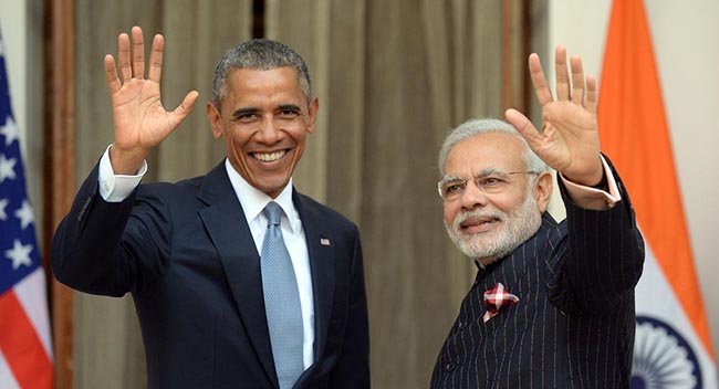 Indian Prime Minister Narendra Modi (R) and US President Barack Obama wave prior to a meeting in New Delhi on January 25, 2015. US President Barack Obama held talks January 25 with Prime Minister Narendra Modi at the start of a three-day India visit aimed at consolidating increasingly close ties between the world's two largest democracies.  AFP PHOTO/ PRAKASH SINGH        (Photo credit should read PRAKASH SINGH/AFP/Getty Images)